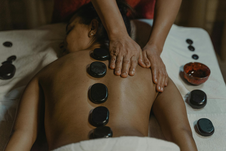 Hot-Stone-Massage Woman receiving a Hot Stones Massage in the spa