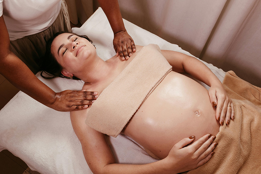 Prenatal-Massage Pregnant woman receiving a Prenatal Massage